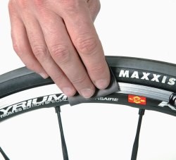 You should not attack your carbon fibre rims with emery paper or solvent!