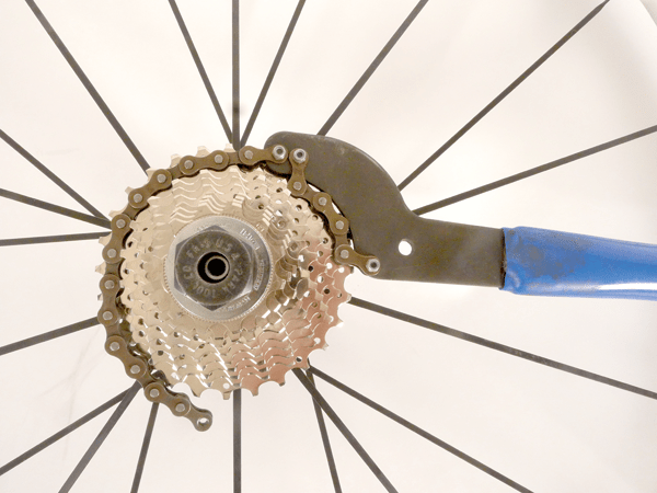 The chain whip sits in the third cog with the handle pointing to the right when you look at the cassette.