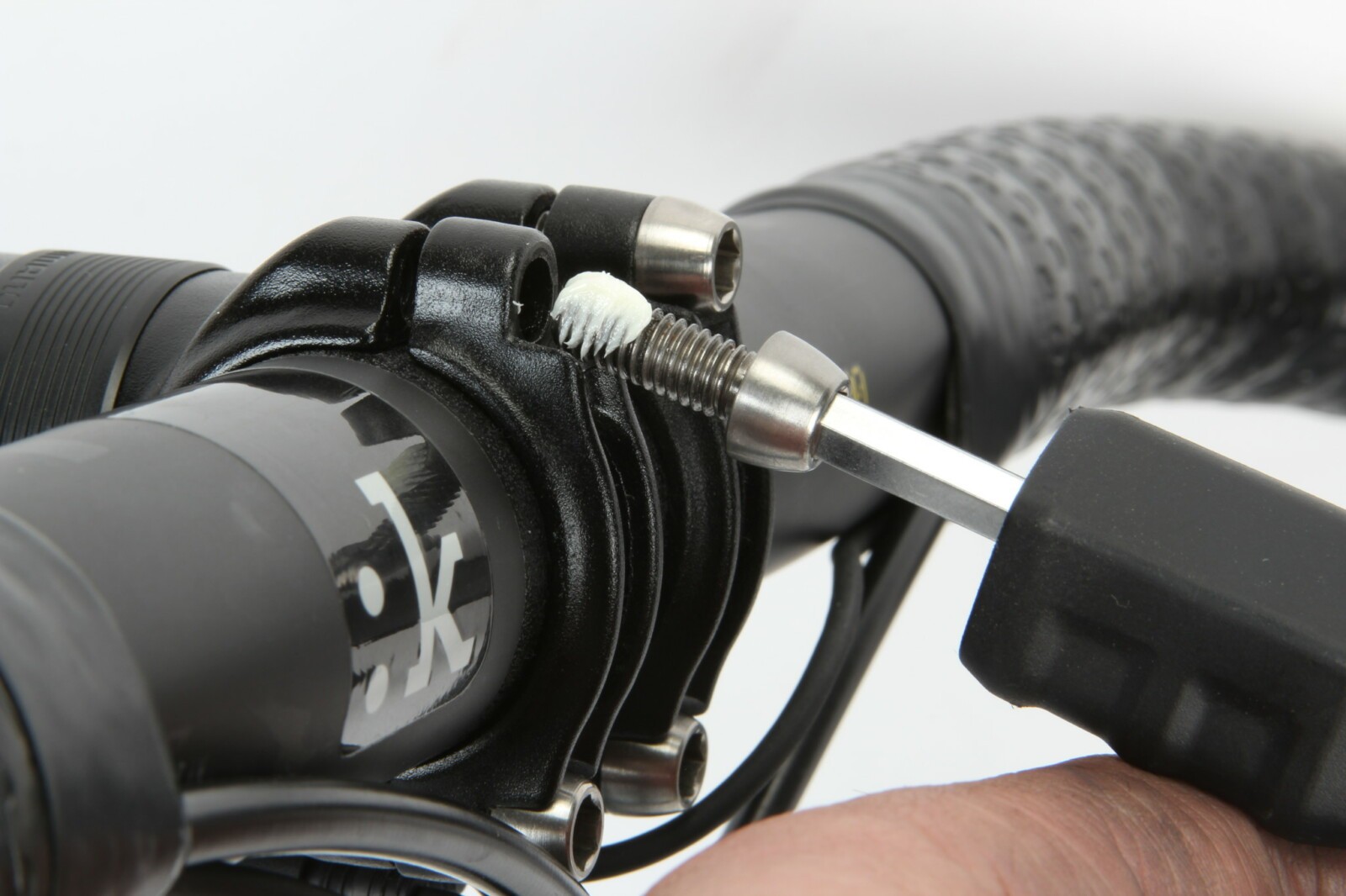 While some applications can benefit from thread lock, we generally prefer to apply a light smear of grease to most bolts. It helps the threads turn smoothly, prevents seizing and means you’re less likely to wind up with rounded out allen heads on the bike.