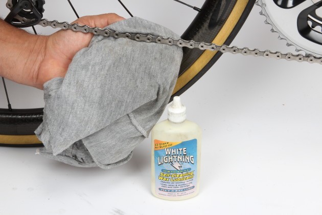 Wipe your chain and re-lube it after every second ride. Do it after every ride if you’re pedalling in the rain or on gravel roads. This may seem excessive but it’s far easier to wipe and clean before it develops a build-up of road grime. Regular inspection may also help you spot any other issues such as stiff or damaged chain links. If the chain is particularly dirty you can put a bit of degreaser on the rag to help loosen the grime but for day-to-day cleaning there’s no need to douse the chain in degreaser. Always wipe off any excess lube as it will attract dirt and be counterproductive.
