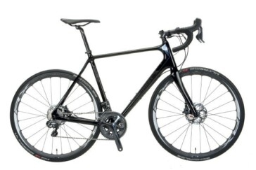 Polygon have given the Helios standard quick release wheels with a clever bolt through dropout for extra wheel security. Also in this shot you can see the disc caliper mount on the fork is very solidly formed.