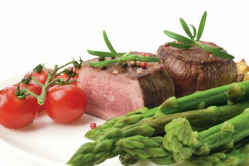 Marcel Kittel in the green Sprint Jersey on Stage 2 of the Tour. Note the graze on his knee from a fall he took on the slick roads earlier that day. Photo by Sirotti