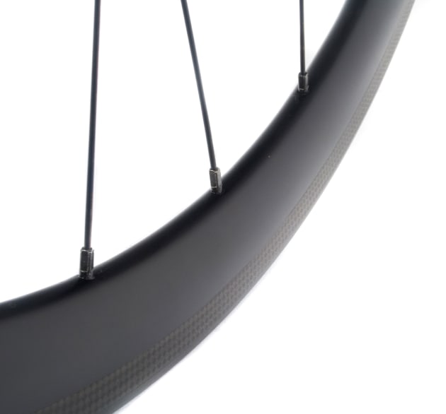 Braking has been markedly improved on carbon fibre rims by the addition of textured finishes, to some degree at the expense of reduced pad life.