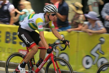 Jay McCarthy waves to supporters during the second lap of the McLaren Vale circuit. Photo: Mark Ryder.