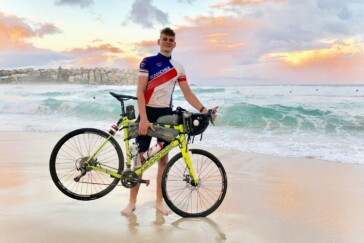 Lochie Kavanagh with his proud dad Andrew on the steps of the Sydney Opera House after his arrival. Image: Nat Bromhead