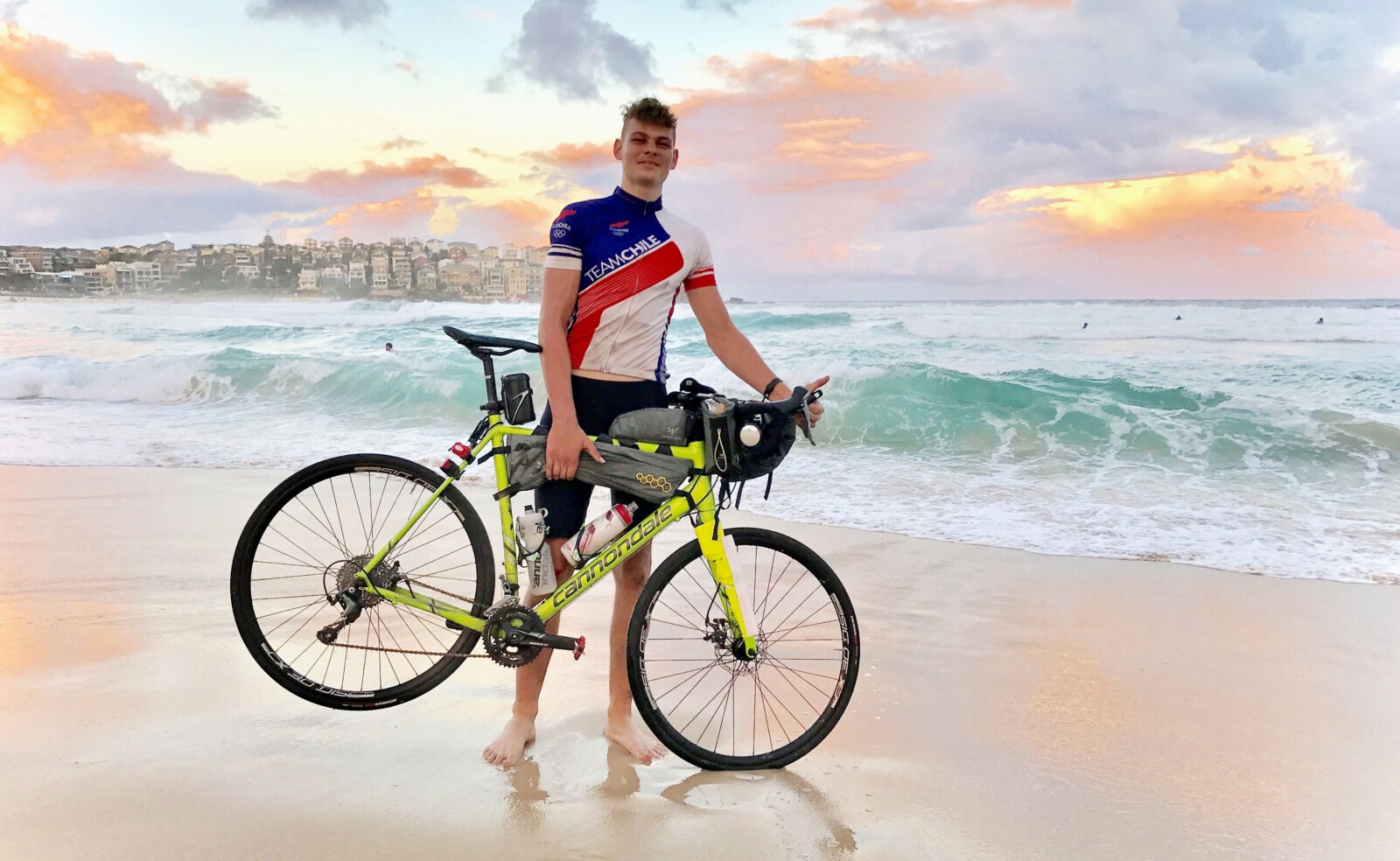 Lochie Kavanagh with his proud dad Andrew on the steps of the Sydney Opera House after his arrival. Image: Nat Bromhead
