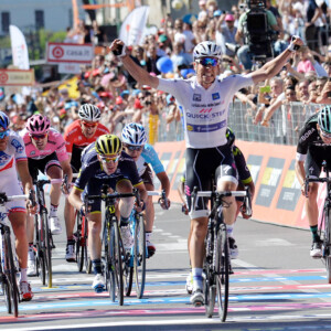 A victorious Bob Jungles after his Stage 15 win. Orica-Scott's Adam Yates (left of frame) finished 4th on the stage. Image: Sirotti.