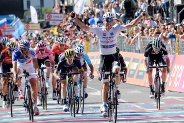 A victorious Bob Jungles after his Stage 15 win. Orica-Scott's Adam Yates (left of frame) finished 4th on the stage. Image: Sirotti.