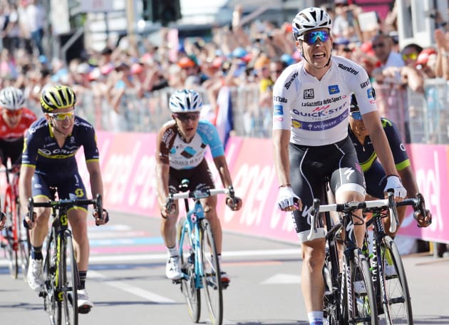 A victorious Bob Jungles after his Stage 15 win. Orica-Scott's Adam Yates (left of frame) finished 4th on the stage. Image: Sirotti.