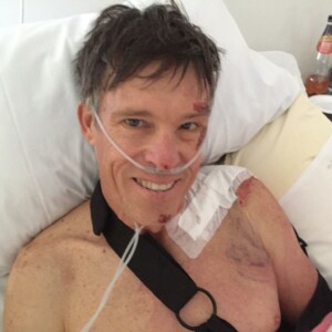 All smiles, Phil Anderson retains his trademark positive persona from his hospital bed. Image: Facebook