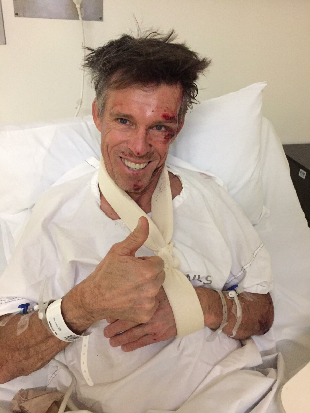 All smiles, Phil Anderson retains his trademark positive persona from his hospital bed. Image: Facebook