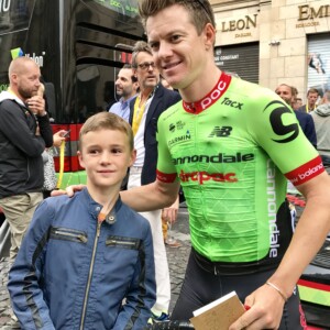 Simon Clarke with a young fan after the finish of the 2017 Tour de France in Paris. Image: Nat Bromhead.
