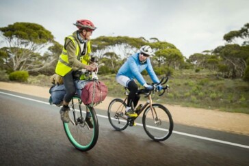 Mark Beaumont and Ed Pratt cycling in remote South Australia. Image: Instagram / @Johnnyswanepoel