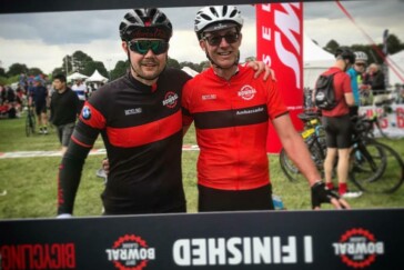 Megan Scott (white jersey) celebrates her Bowral Classic success with members of the Giant Sydney Cycling Club at the event village.