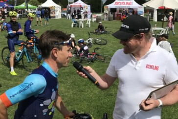 Megan Scott (white jersey) celebrates her Bowral Classic success with members of the Giant Sydney Cycling Club at the event village.