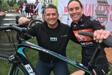 Megan Scott (white jersey) celebrates her Bowral Classic success with members of the Giant Sydney Cycling Club at the event village.