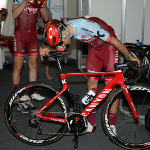 A Katusha mechanic works on one of the team bikes after a 2018 Santos Tour Down Under reeky ride.