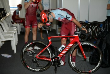 A Katusha mechanic works on one of the team bikes after a 2018 Santos Tour Down Under reeky ride.
