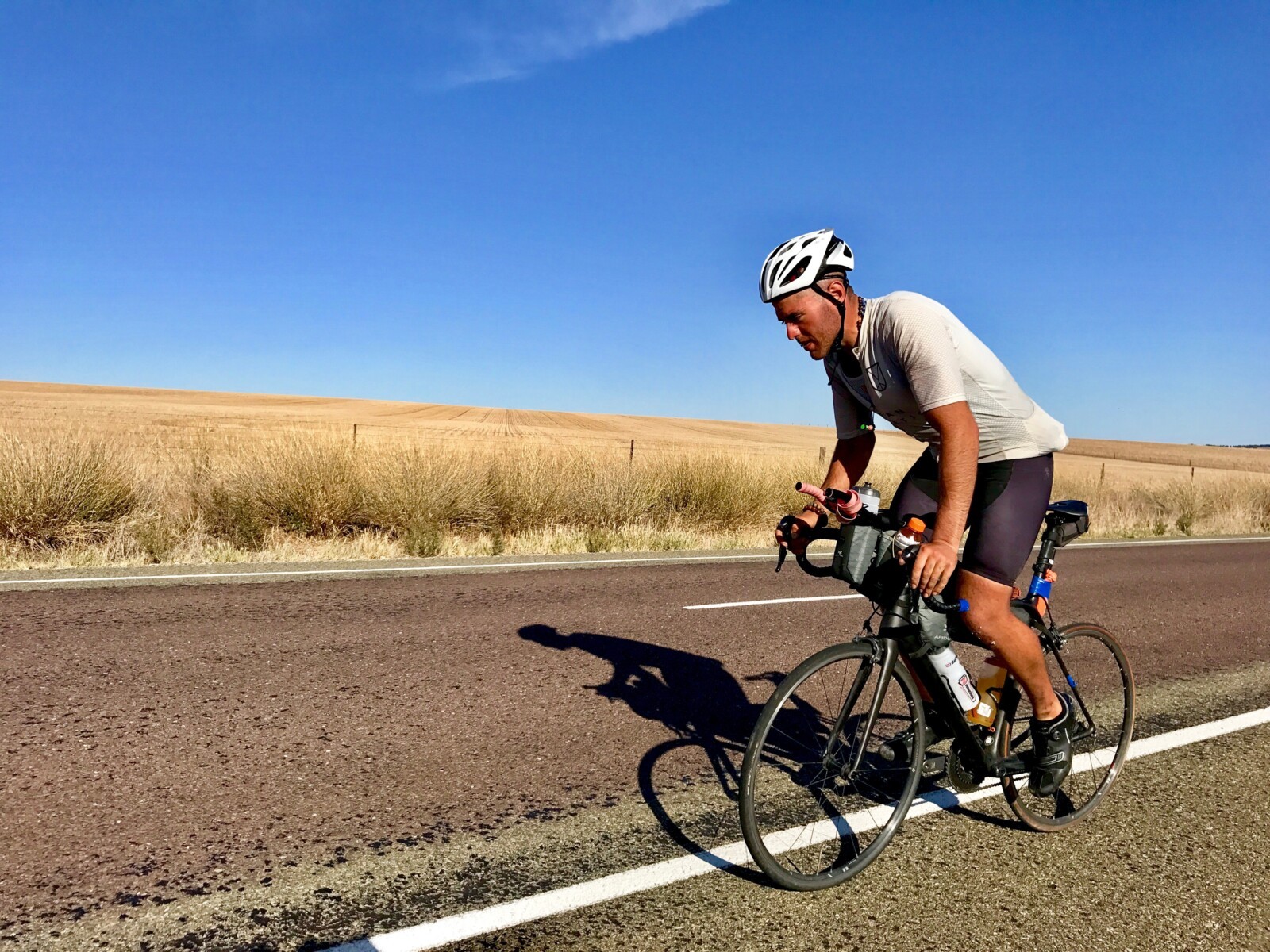Totally focussed and averaging close to 500km per day, Abdullah Zeinab just north of Clare in the Clare Valley during the unofficial 2018 Indian Pacific Wheel Race. Image: Nat Bromhead