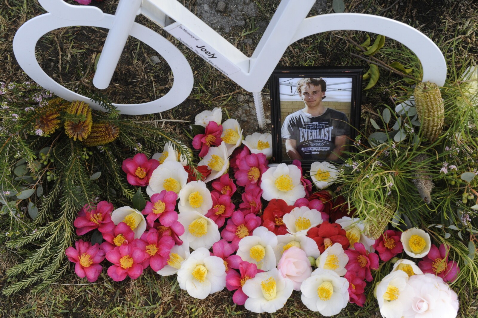 Mourners including Les Hawkins and Trudi and Graeme Lowndes gathered at the tribute on Saturday. Image: Supplied.