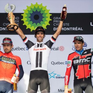 Megan Scott (white jersey) celebrates her Bowral Classic success with members of the Giant Sydney Cycling Club at the event village.
