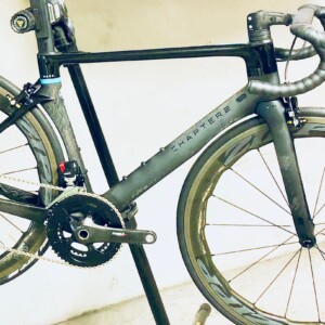 Megan Scott (white jersey) celebrates her Bowral Classic success with members of the Giant Sydney Cycling Club at the event village.