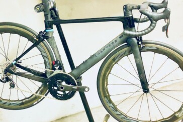 Megan Scott (white jersey) celebrates her Bowral Classic success with members of the Giant Sydney Cycling Club at the event village.