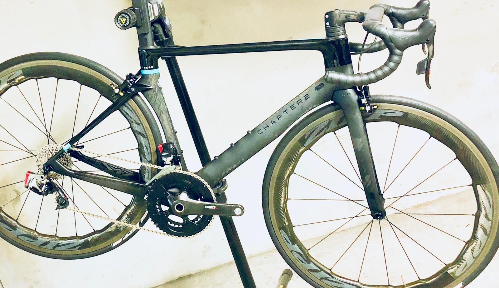 Megan Scott (white jersey) celebrates her Bowral Classic success with members of the Giant Sydney Cycling Club at the event village.