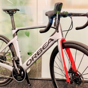 Megan Scott (white jersey) celebrates her Bowral Classic success with members of the Giant Sydney Cycling Club at the event village.