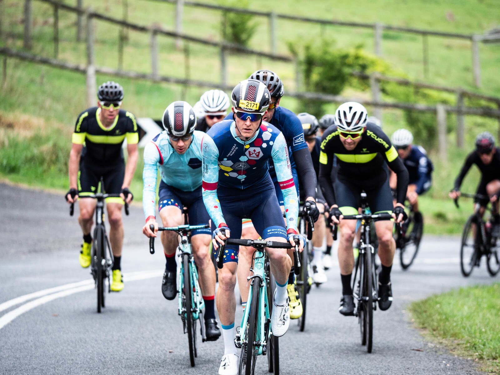 Megan Scott (white jersey) celebrates her Bowral Classic success with members of the Giant Sydney Cycling Club at the event village.