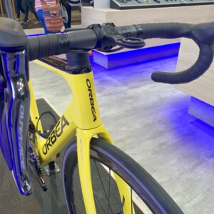 Megan Scott (white jersey) celebrates her Bowral Classic success with members of the Giant Sydney Cycling Club at the event village.