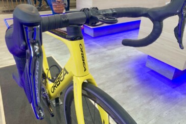 Megan Scott (white jersey) celebrates her Bowral Classic success with members of the Giant Sydney Cycling Club at the event village.