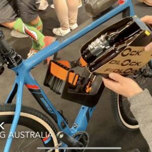 Megan Scott (white jersey) celebrates her Bowral Classic success with members of the Giant Sydney Cycling Club at the event village.