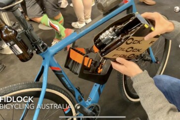 Megan Scott (white jersey) celebrates her Bowral Classic success with members of the Giant Sydney Cycling Club at the event village.