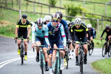 Megan Scott (white jersey) celebrates her Bowral Classic success with members of the Giant Sydney Cycling Club at the event village.