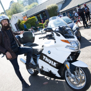 Beardy Mc Beard aboard the Thule moto with pilot Jacob. Image Tim Levy.